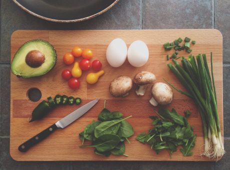 Clean eating image with veggies on cutting board